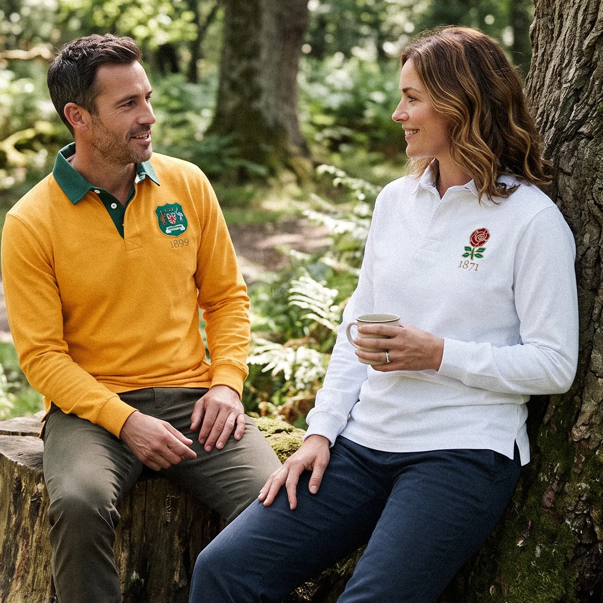 Rugby 1823 Heritage Pure Cotton Rugby Shirts A man and a woman sit in a sunny woodland chatting. They are both wearing rugby shirts from the Rugby 1823 range.